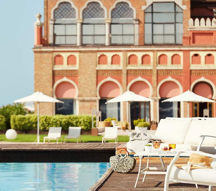 The exteriors of Hotel Excelsior Venice Lido Resort from the outdoor pool | Luxury hotel in Venice, Italy