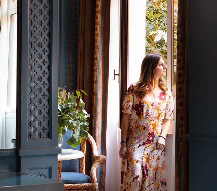 A guest looking outside her room | Hotel Excelsior Venice Lido Resort
