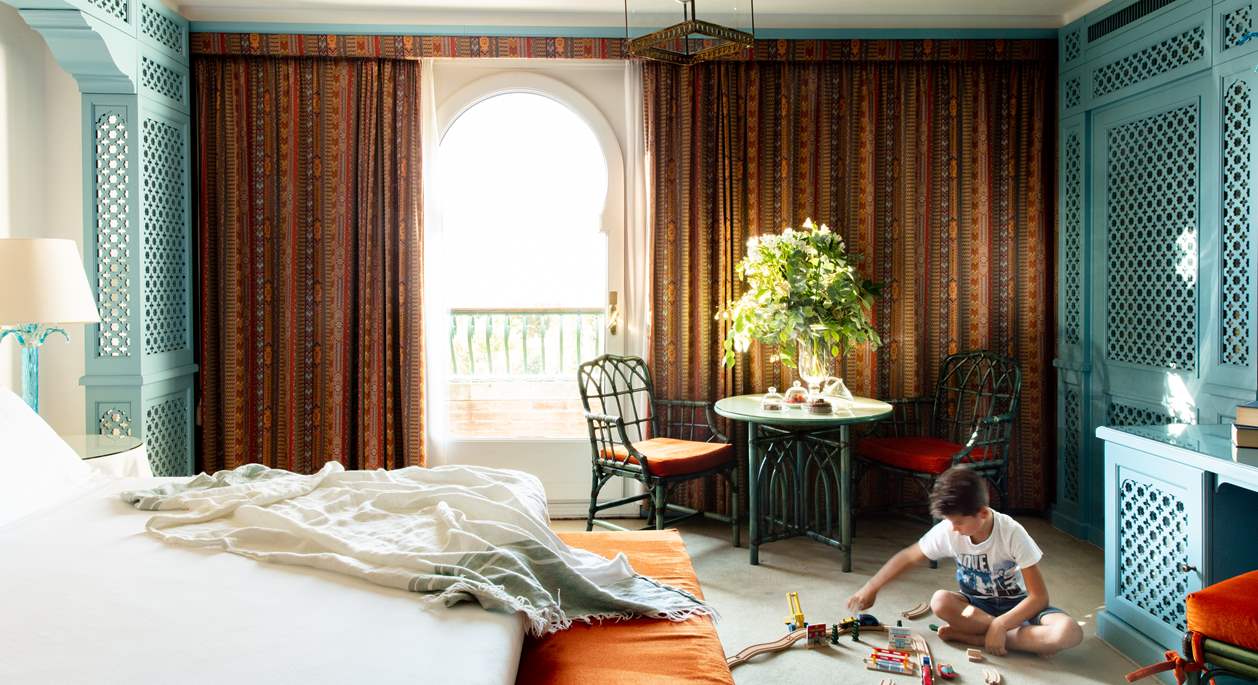 A kid playing inside a suite of Hotel Excelsior Venice Lido Resort | Luxury suites in Venice, Italy