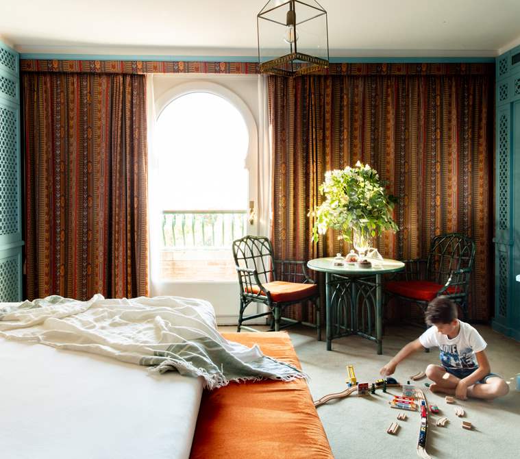 A kid playing inside a suite of Hotel Excelsior Venice Lido Resort | Luxury suites in Venice, Italy