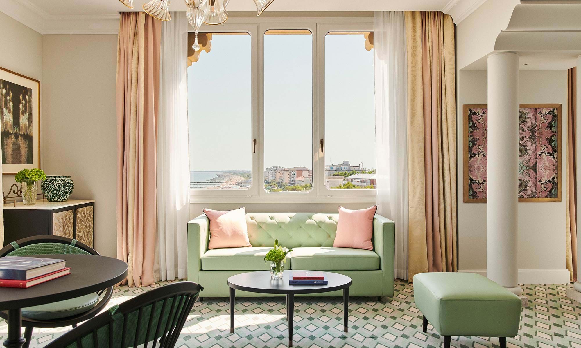 Bright venetian luxury suite overlooking the Lido coastline, reflecting refined suites in Venice, Italy.