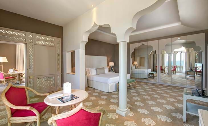 Spacious venice suite with Moorish arches and mirrored décor, a signature venetian luxury suite in Italy.